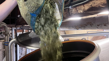 Hops being added to the copper in the brewhouse