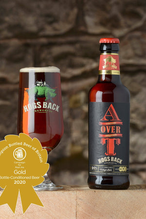 A over T Barley Wine beer bottle and half pint beer glass with Champion Bottled Beer of Britain Gold medal - A over T - Champion Bottled Beer of Britain 2020 - Hogs Back Brewery