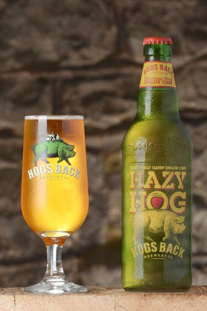 Bottle of Hazy Hog apple cider with half pint glass - Hazy Hog Cider x12 - Hogs Back Brewery