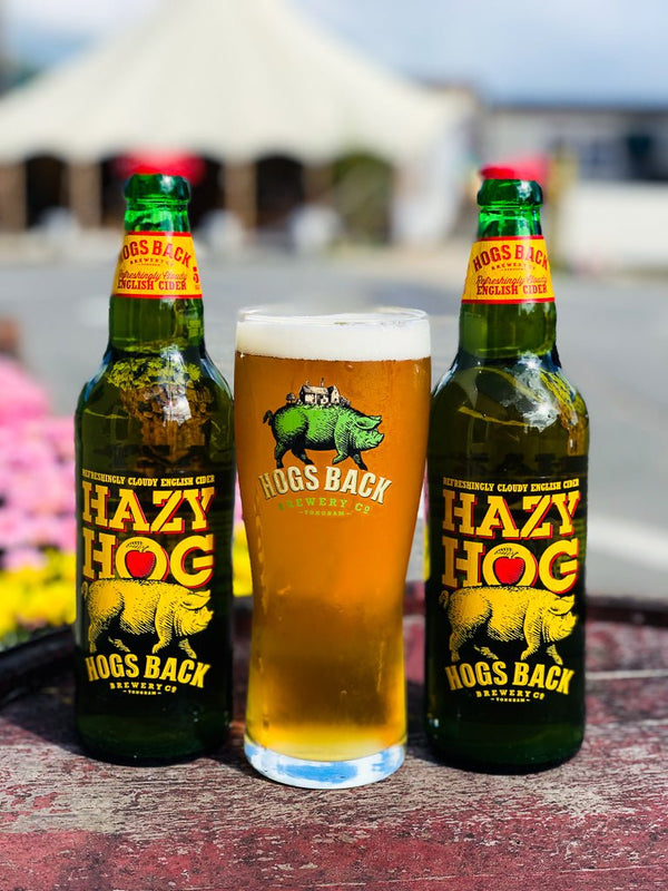 Two bottles of Hazy Hog apple cider with pint beer glass - Hazy Hog Gift Set - Hogs Back Brewery
